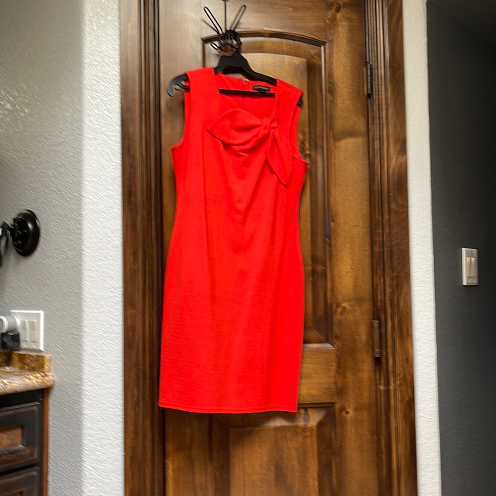 Bright color coral dress.